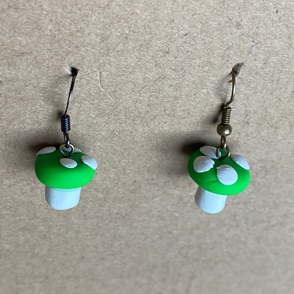 Small Green mushroom earrings.